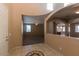 Bright entryway with tile floors, high ceilings, and views to the living areas at 7242 W Ellis St, Laveen, AZ 85339