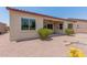 House exterior with desert landscaping and a covered patio at 20285 N Winter Escape Ct, Maricopa, AZ 85138