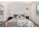 Spacious bedroom with a large bed and two nightstands at 20285 N Winter Escape Ct, Maricopa, AZ 85138
