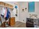 Laundry room with shelving, hanging rod, and storage at 20285 N Winter Escape Ct, Maricopa, AZ 85138