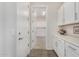 Bright laundry room with white cabinets and washer/dryer hookups at 20285 N Winter Escape Ct, Maricopa, AZ 85138