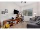 Home office with built-in shelving, desk, and comfortable seating at 20285 N Winter Escape Ct, Maricopa, AZ 85138