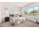 Bright bedroom with a queen-size bed and large windows at 20285 N Winter Escape Ct, Maricopa, AZ 85138