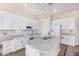 Modern kitchen with white cabinets, granite countertops, and stainless steel appliances at 20285 N Winter Escape Ct, Maricopa, AZ 85138
