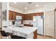 Modern kitchen with white quartz countertops and wood cabinetry at 1560 E Melrose Dr, Casa Grande, AZ 85122
