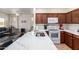 Modern kitchen with an eat-in island, updated appliances, and lots of counter space at 1560 E Melrose Dr, Casa Grande, AZ 85122