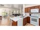 Open kitchen concept with a breakfast bar, modern appliances, and ample counter space at 1560 E Melrose Dr, Casa Grande, AZ 85122