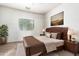 Relaxing Primary bedroom with a king-size bed and wood furniture at 1560 E Melrose Dr, Casa Grande, AZ 85122