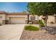 Well-maintained home exterior with two car garage and landscaping at 1560 E Melrose Dr, Casa Grande, AZ 85122
