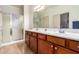 Double vanity bathroom with a shower and lots of cabinet space at 1560 E Melrose Dr, Casa Grande, AZ 85122