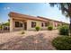 Tan stucco exterior with a covered patio at 1560 E Melrose Dr, Casa Grande, AZ 85122