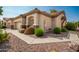 Well-maintained home with attractive landscaping and a two-car garage at 1560 E Melrose Dr, Casa Grande, AZ 85122