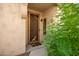Inviting front door entrance with decorative screen door and landscaping at 1560 E Melrose Dr, Casa Grande, AZ 85122
