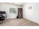 Bright home office features built-in shelving and carpet at 1560 E Melrose Dr, Casa Grande, AZ 85122