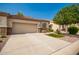 Attached garage with driveway and desert landscaping at 1560 E Melrose Dr, Casa Grande, AZ 85122