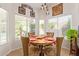 Bright breakfast nook with wood table and four chairs, overlooking the backyard at 4536 E Via Dona Rd, Cave Creek, AZ 85331