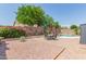 Landscaped backyard with a patio, seating area, and pool at 4536 E Via Dona Rd, Cave Creek, AZ 85331