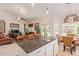 Open concept kitchen with granite island, breakfast bar, and views of the living room at 4536 E Via Dona Rd, Cave Creek, AZ 85331