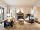 Bright sitting room with ornate fireplace and hardwood floors at 40 Biltmore Est, Phoenix, AZ 85016