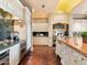 Bright kitchen with hardwood floors, granite countertops, and ample cabinet space at 40 Biltmore Est, Phoenix, AZ 85016