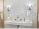 Luxury powder room with marble sink and Art Deco light fixtures at 40 Biltmore Est, Phoenix, AZ 85016