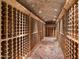 Extensive wine cellar with brick floor and arched ceiling at 40 Biltmore Est, Phoenix, AZ 85016