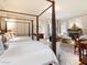 Main bedroom with two beds and sitting area at 40 Biltmore Est, Phoenix, AZ 85016