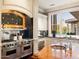 Gourmet kitchen with stainless steel appliances and granite countertops at 40 Biltmore Est, Phoenix, AZ 85016