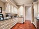 Elegant butler's pantry with ample cabinetry and granite countertops at 40 Biltmore Est, Phoenix, AZ 85016