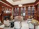 Spacious library with built-in bookshelves, a fireplace, and comfortable seating at 40 Biltmore Est, Phoenix, AZ 85016