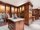 Custom walk-in closet with island and extensive storage at 40 Biltmore Est, Phoenix, AZ 85016