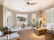 Bright sunroom with seating area, round table, and backyard access at 40 Biltmore Est, Phoenix, AZ 85016