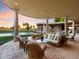 Covered patio overlooking the pool and lush green landscape at 40 Biltmore Est, Phoenix, AZ 85016