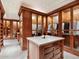 Large walk-in closet with ample custom built-ins and shelving at 40 Biltmore Est, Phoenix, AZ 85016