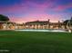 Expansive backyard oasis featuring a large pool and lush green lawn at 40 Biltmore Est, Phoenix, AZ 85016