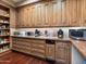 Butlers pantry with wood cabinets, ample drawers, and a microwave at 40 Biltmore Est, Phoenix, AZ 85016