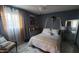 Elegant bedroom with a comfortable bed and gold accents at 5753 N 31St Ln, Phoenix, AZ 85017