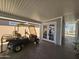 Covered carport with golf cart and storage at 650 N Hawes Rd # 3404, Mesa, AZ 85207