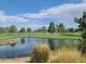 Picturesque golf course with pond and green at 650 N Hawes Rd # 3404, Mesa, AZ 85207