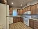 Spacious kitchen featuring wood cabinets and tile floors at 650 N Hawes Rd # 3404, Mesa, AZ 85207