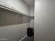 Well-lit walk-in closet with shelving and hanging rod at 650 N Hawes Rd # 3404, Mesa, AZ 85207