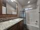 Bathroom with shower/tub combo, vanity, and mirror at 650 N Hawes Rd # 3404, Mesa, AZ 85207