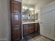 Double vanity bathroom with ample storage and mirror at 650 N Hawes Rd # 3404, Mesa, AZ 85207