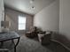 Bedroom with two chairs and carpeted floors at 650 N Hawes Rd # 3404, Mesa, AZ 85207