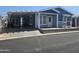 Nice curb appeal, covered parking, and welcoming front porch at 650 N Hawes Rd # 3404, Mesa, AZ 85207