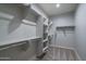 Large walk-in closet with shelving and hanging rods at 16172 W Alameda Rd, Surprise, AZ 85387