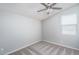 Well-lit bedroom with ceiling fan and window at 16172 W Alameda Rd, Surprise, AZ 85387