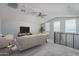 Spacious loft area with comfortable seating and a TV at 16172 W Alameda Rd, Surprise, AZ 85387