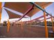 Modern playground with shade structures and swings at 16172 W Alameda Rd, Surprise, AZ 85387