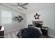 Cozy bedroom with a ceiling fan and window blinds at 16172 W Alameda Rd, Surprise, AZ 85387